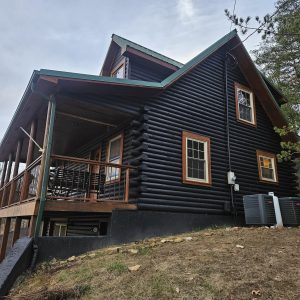 stain log cabin dark Maintain a Log Home Exterior