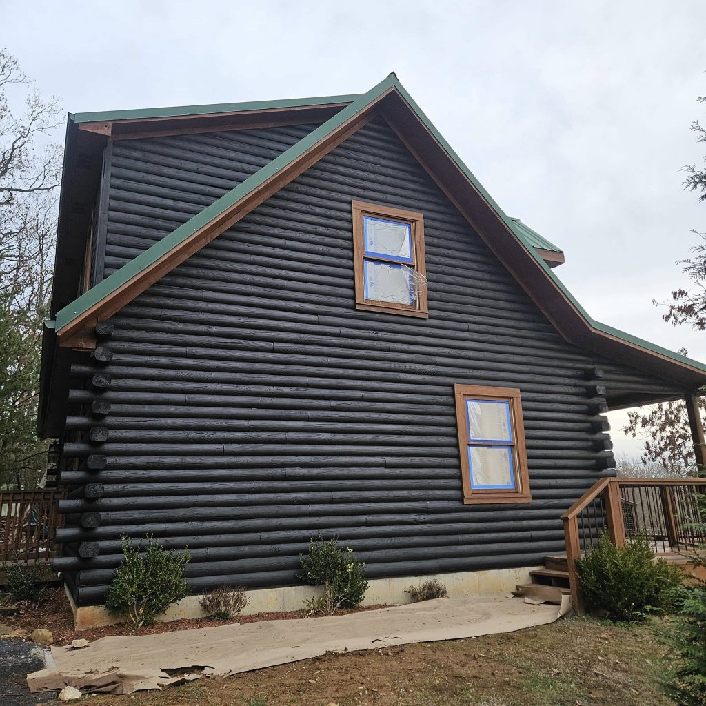 dark black log cabin home stain
