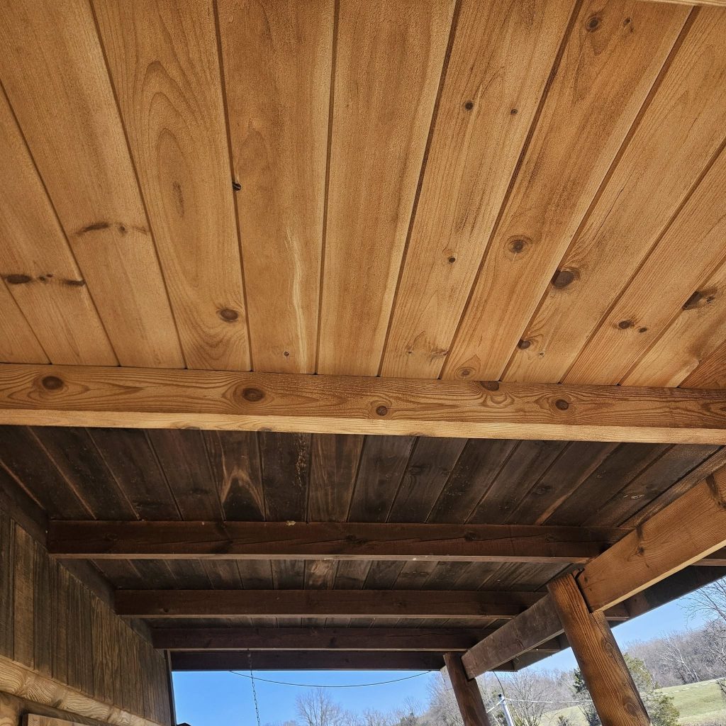media blasting old wood on cabin porch