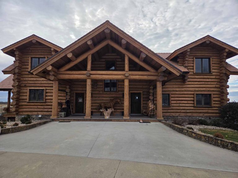 front entry way of a log cabin with a natural stain color